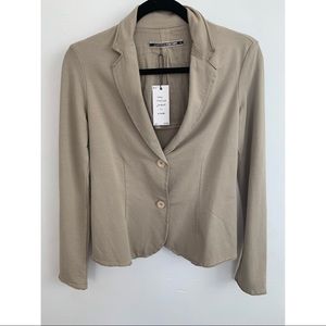 Brand new. Long sleeved jacket in khaki. $55 obo